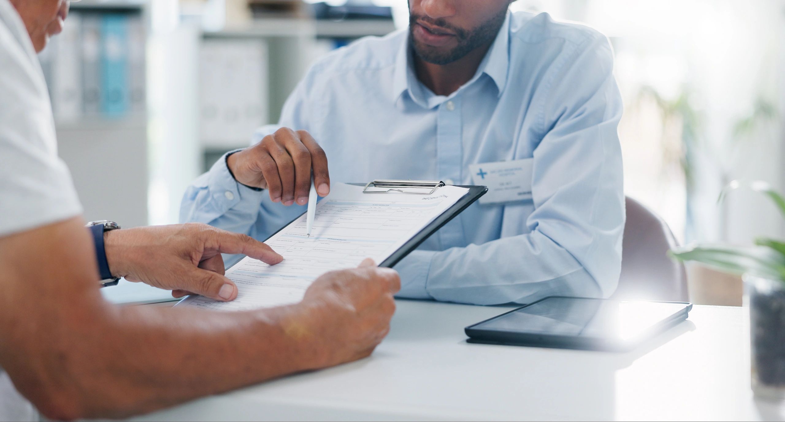 Friendly insurance expert reviewing health coverage options with a client